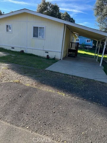 a view of backyard with barbeque grill and roof