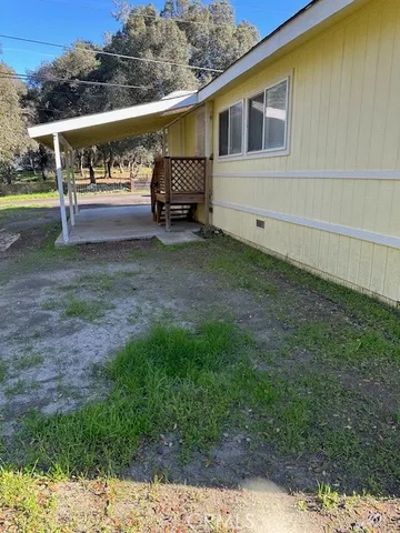 a view of house with backyard and entertaining space