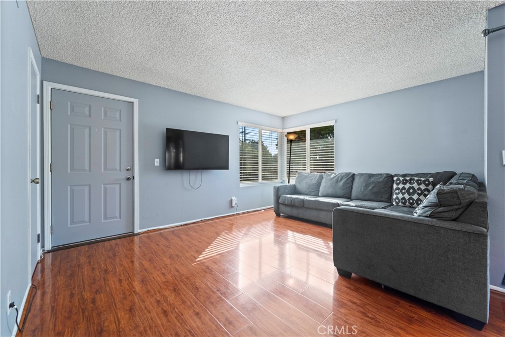 811 Cinnamon Lane Duarte, CA 91010 - Photo 16 of 22 a living room with furniture and a flat screen tv