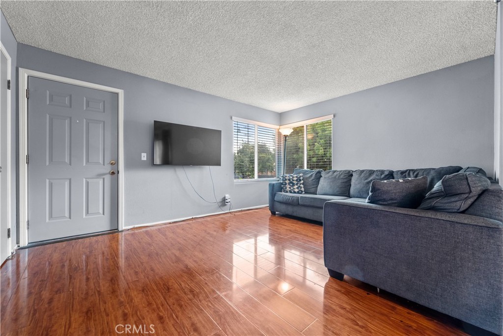 811 Cinnamon Lane Duarte, CA 91010 - Photo 2 of 22 a living room with furniture and a flat screen tv