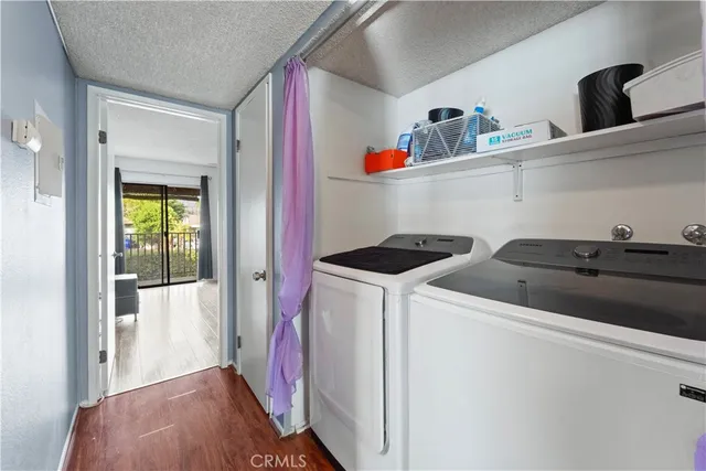 a utility room with sink dryer and washer