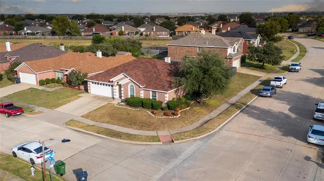 an aerial view of residential houses with outdoor space
