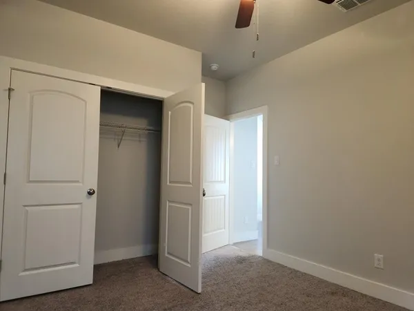 a view of a hallway with closet