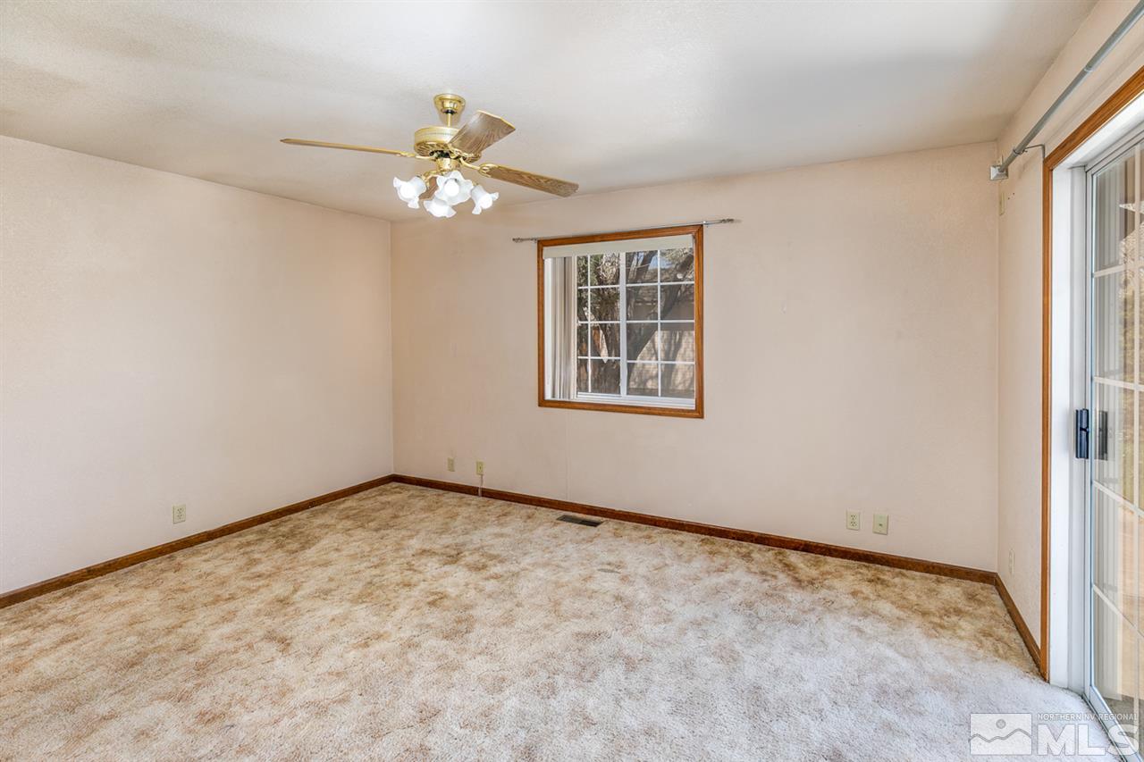 5860 Rivers Edge Drive Fallon, NV 89406 - Photo 25 of 34 an empty room with a window and a fan