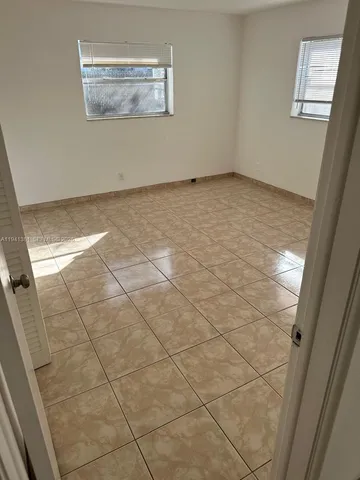 a view of a room with white walls