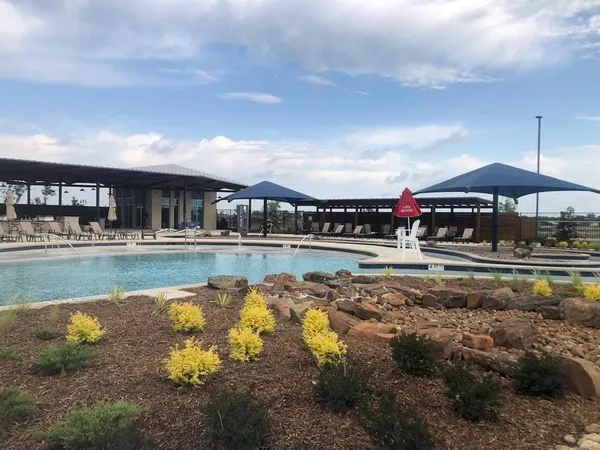 a swimming pool view with a outdoor space