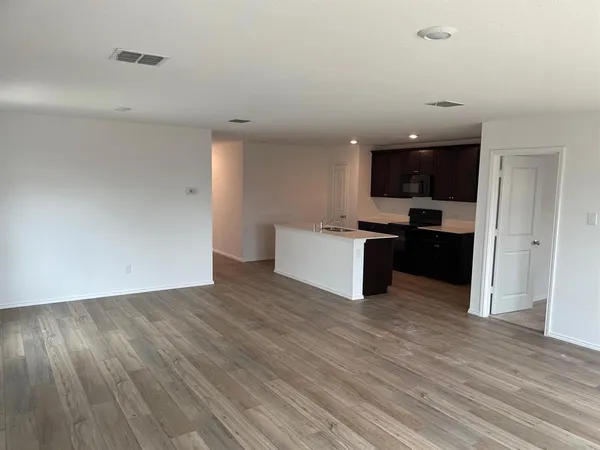 a view of kitchen with wooden floor
