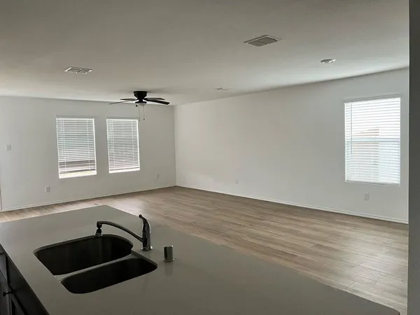a bathroom with a sink and a window