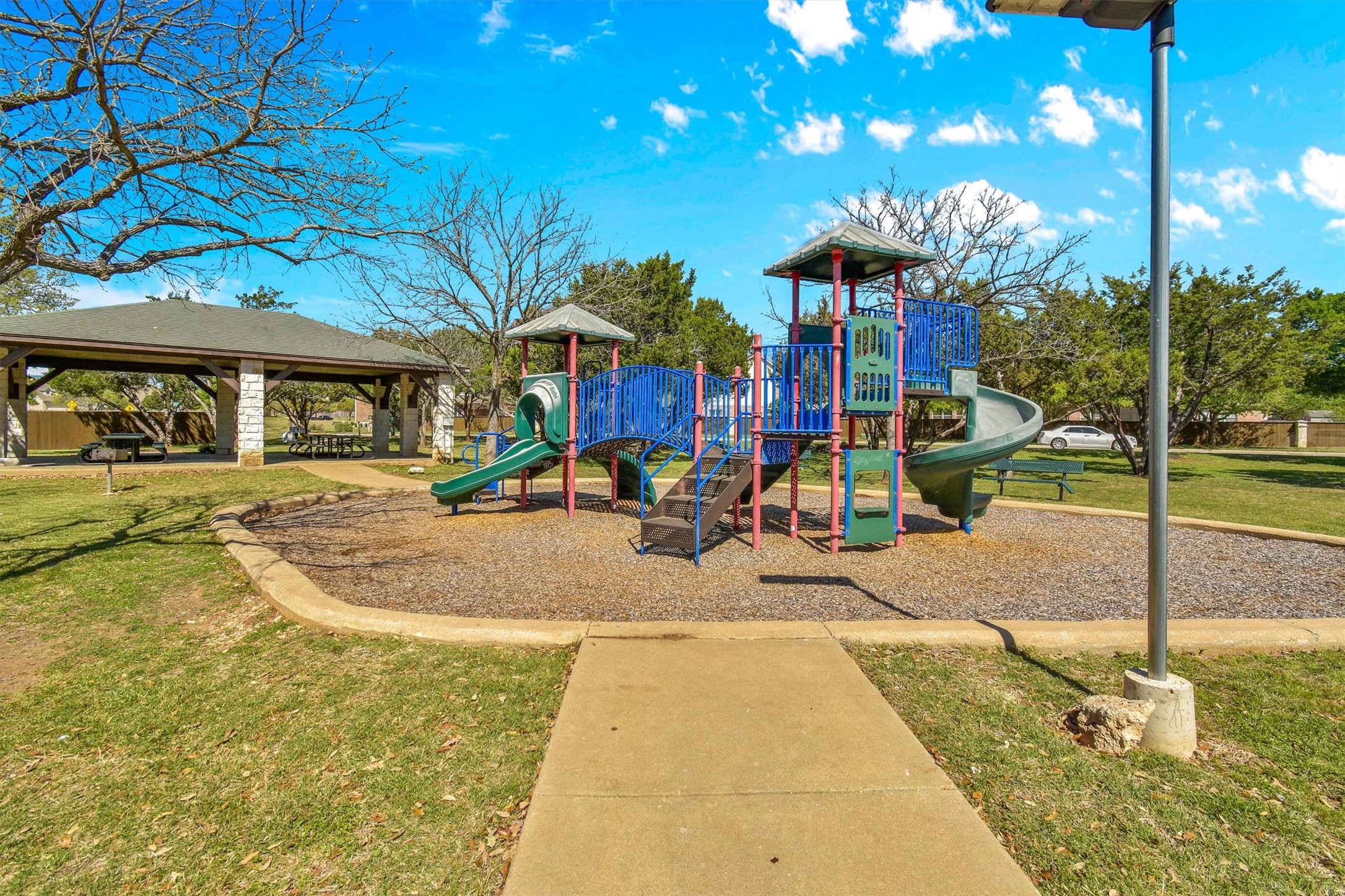 92 Verde Ranch Loop Leander, TX 78641 - Photo 32 of 37 Community jungle gym featuring a yard and a patio