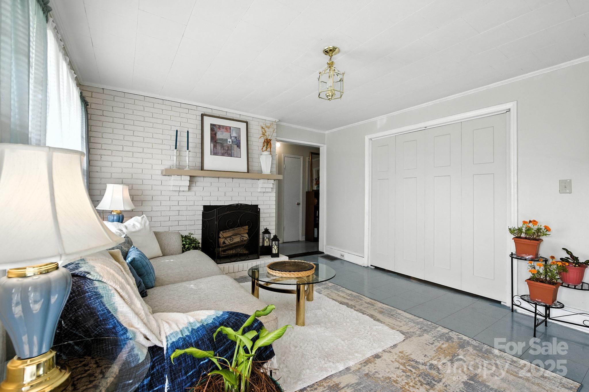 420 Virginia Street Southwest Lenoir, NC 28645 - Photo 11 of 36 a living room with furniture and a fireplace