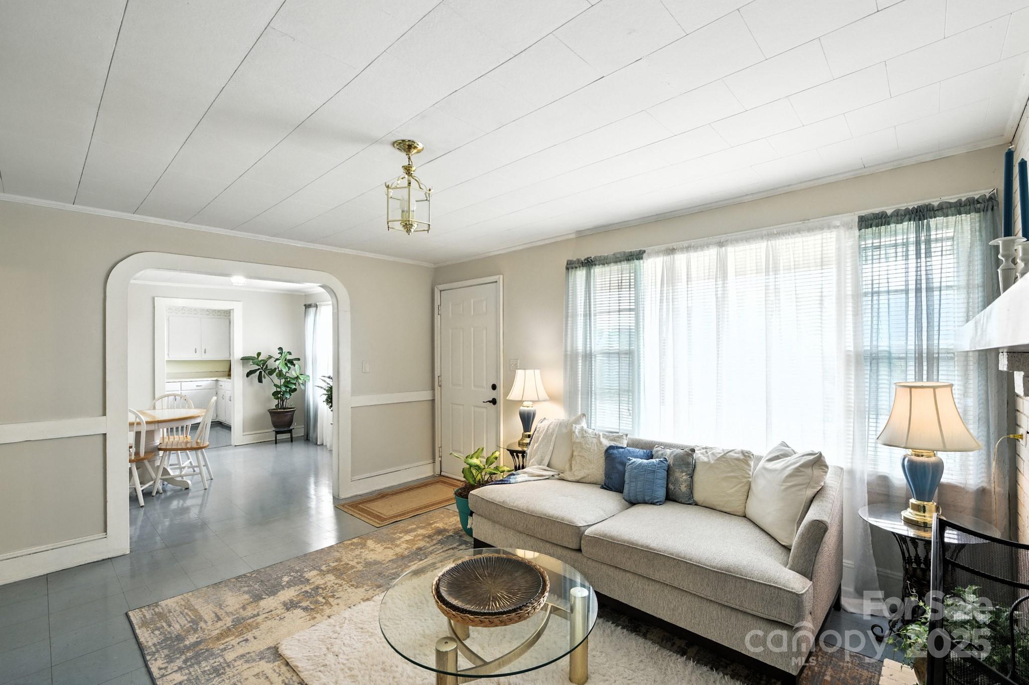 420 Virginia Street Southwest Lenoir, NC 28645 - Photo 13 of 36 a living room with furniture and a large window