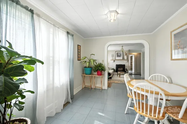 a kitchen with a white sink and cabinets