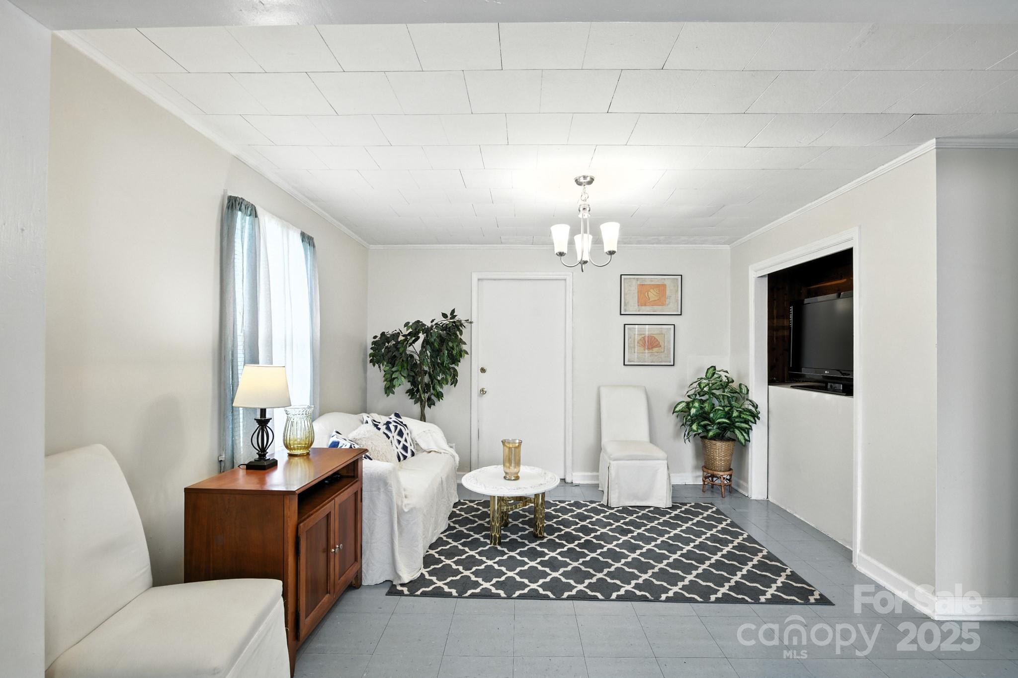 420 Virginia Street Southwest Lenoir, NC 28645 - Photo 21 of 36 a living room with furniture and a potted plant