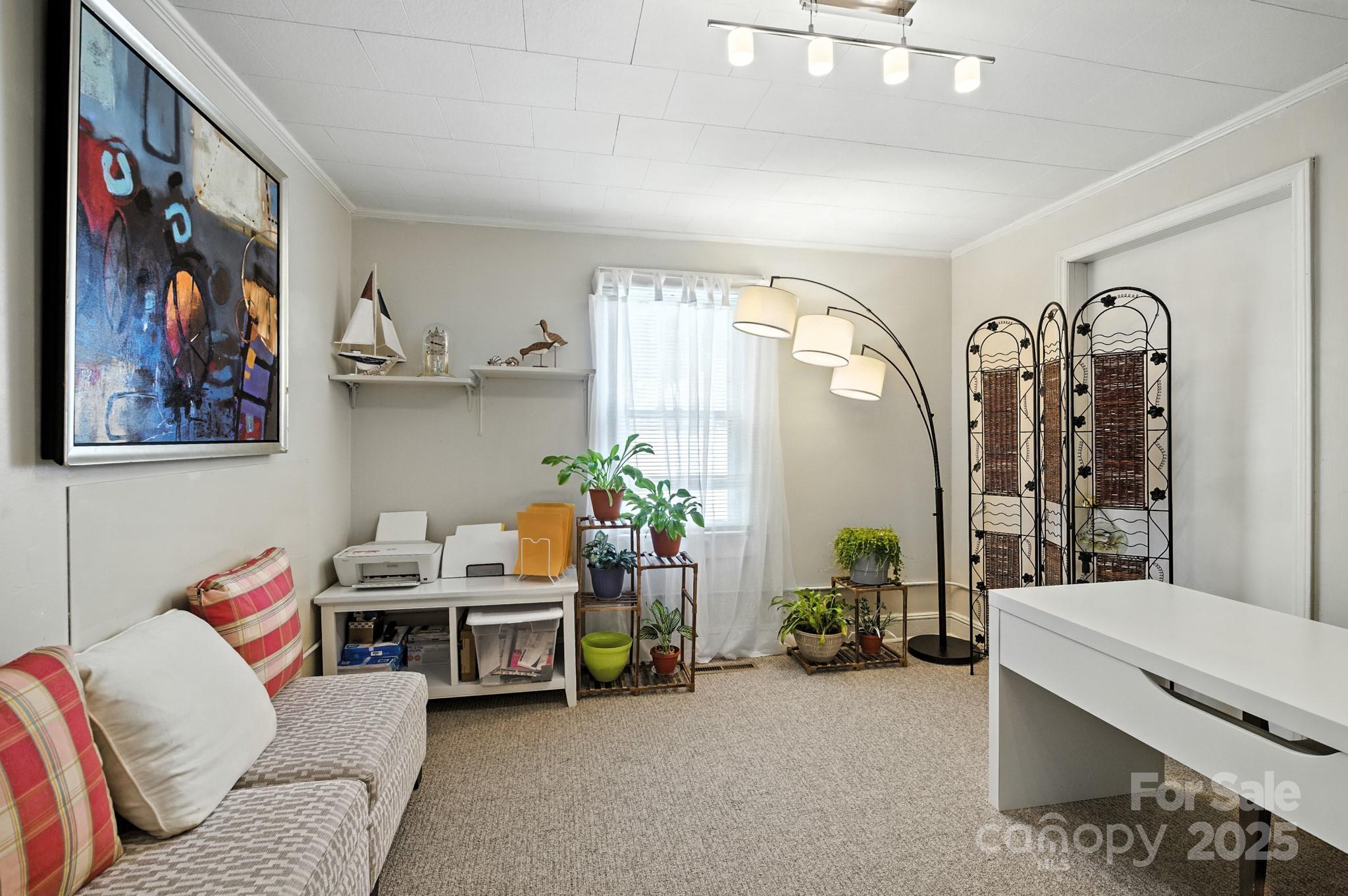 420 Virginia Street Southwest Lenoir, NC 28645 - Photo 24 of 36 a living room with furniture and a painting on the wall