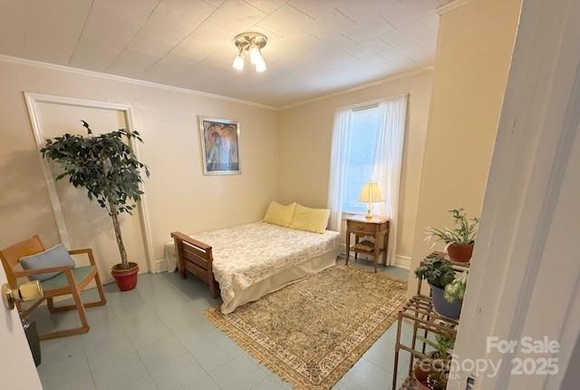 420 Virginia Street Southwest Lenoir, NC 28645 - Photo 30 of 36 a bedroom with a bed and a chandelier