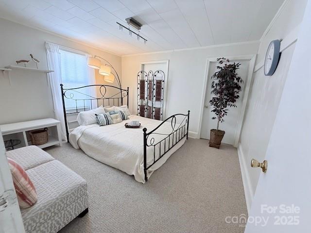 420 Virginia Street Southwest Lenoir, NC 28645 - Photo 31 of 36 a bedroom with a bed and a couch