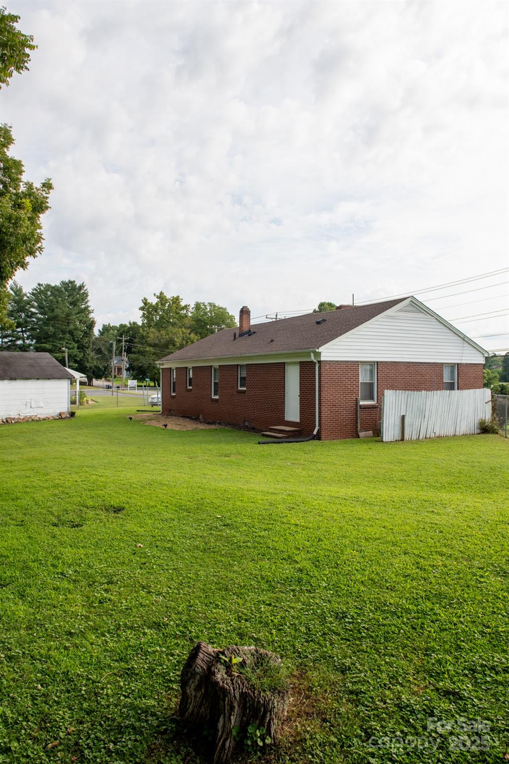 420 Virginia Street Southwest Lenoir, NC 28645 - Photo 6 of 36 a view of a house with a backyard