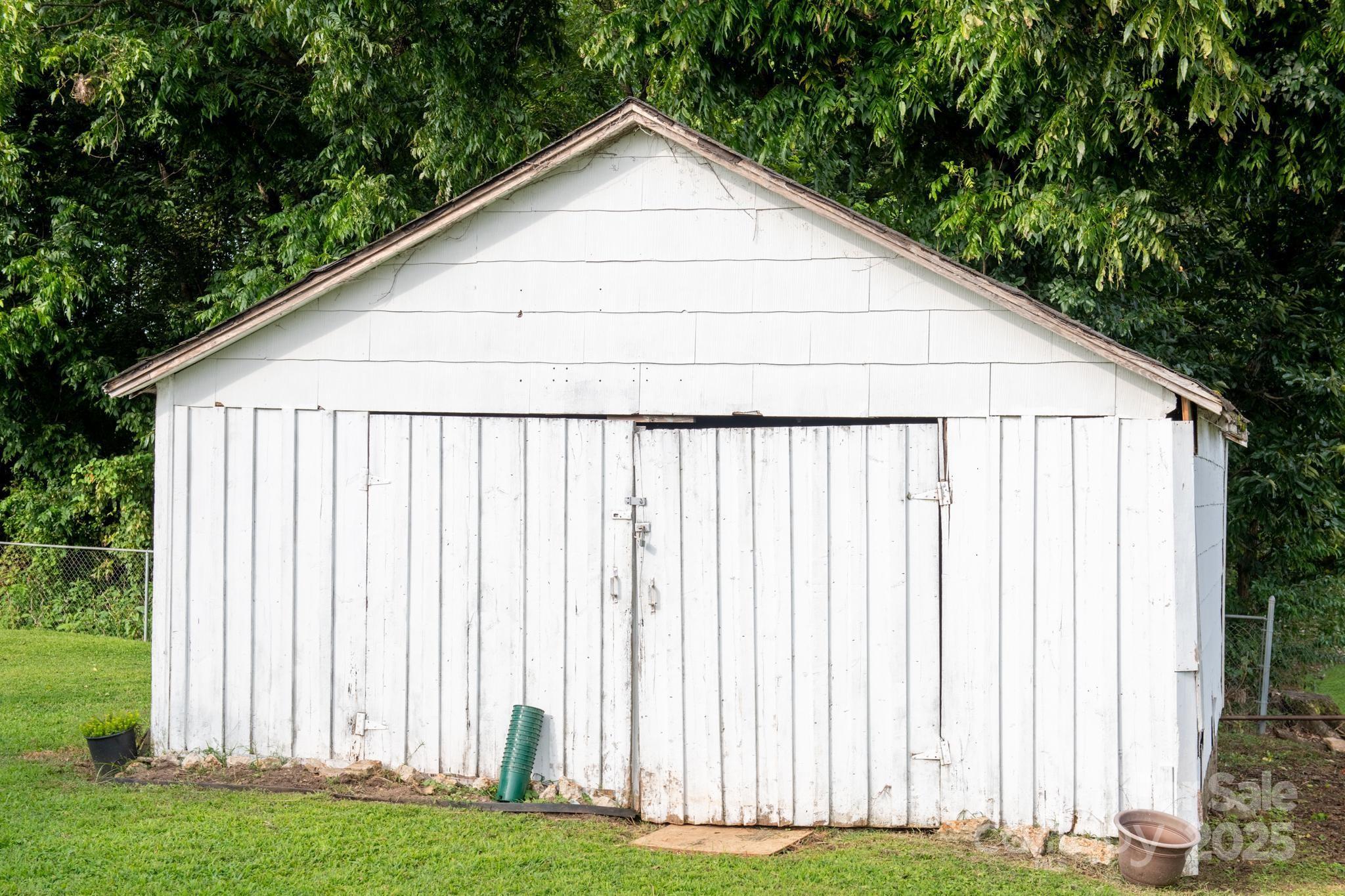 420 Virginia Street Southwest Lenoir, NC 28645 - Photo 8 of 36 a view of a backyard with wooden fence