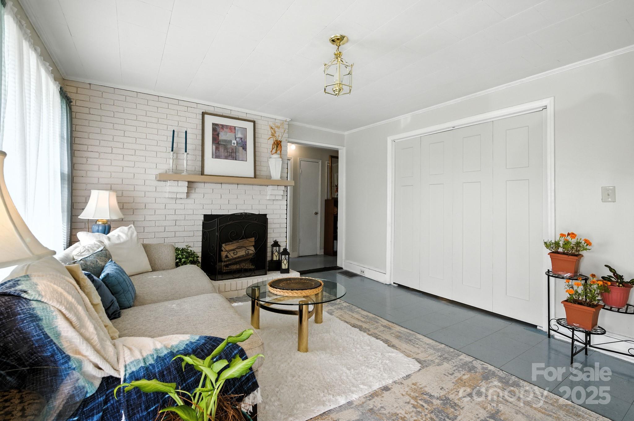 420 Virginia Street Southwest Lenoir, NC 28645 - Photo 9 of 36 a living room with furniture and a fireplace