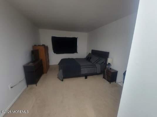 26 Judson Street, Unit 3A Edison, NJ 08837 - Photo 7 of 10 a living room with furniture and a flat screen tv