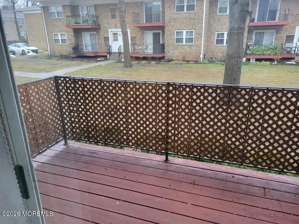 a room with pool table and chairs