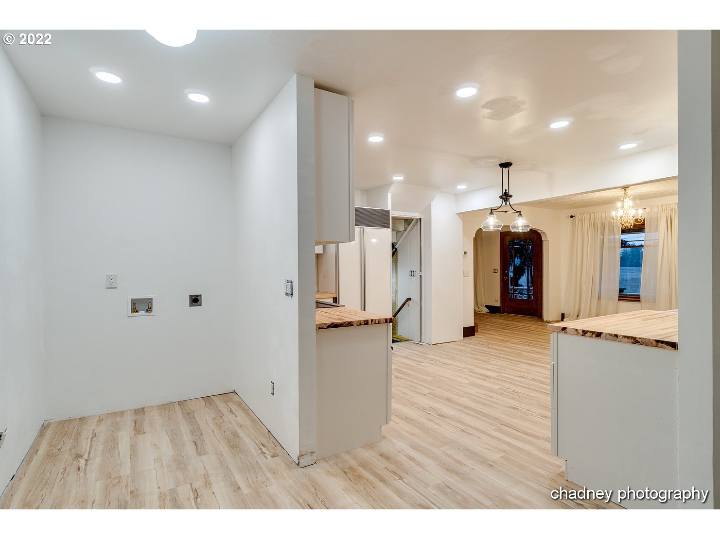 606 Southeast Northway Road Corbett, OR 97019 - Photo 13 of 32 a view of a kitchen with refrigerator and wooden floor