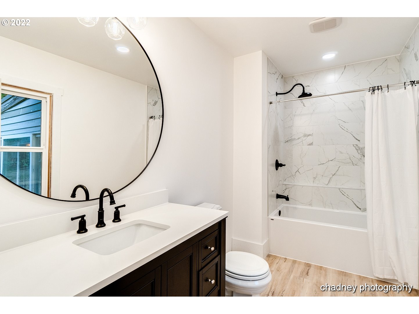 606 Southeast Northway Road Corbett, OR 97019 - Photo 17 of 32 a bathroom with a sink a toilet and a mirror