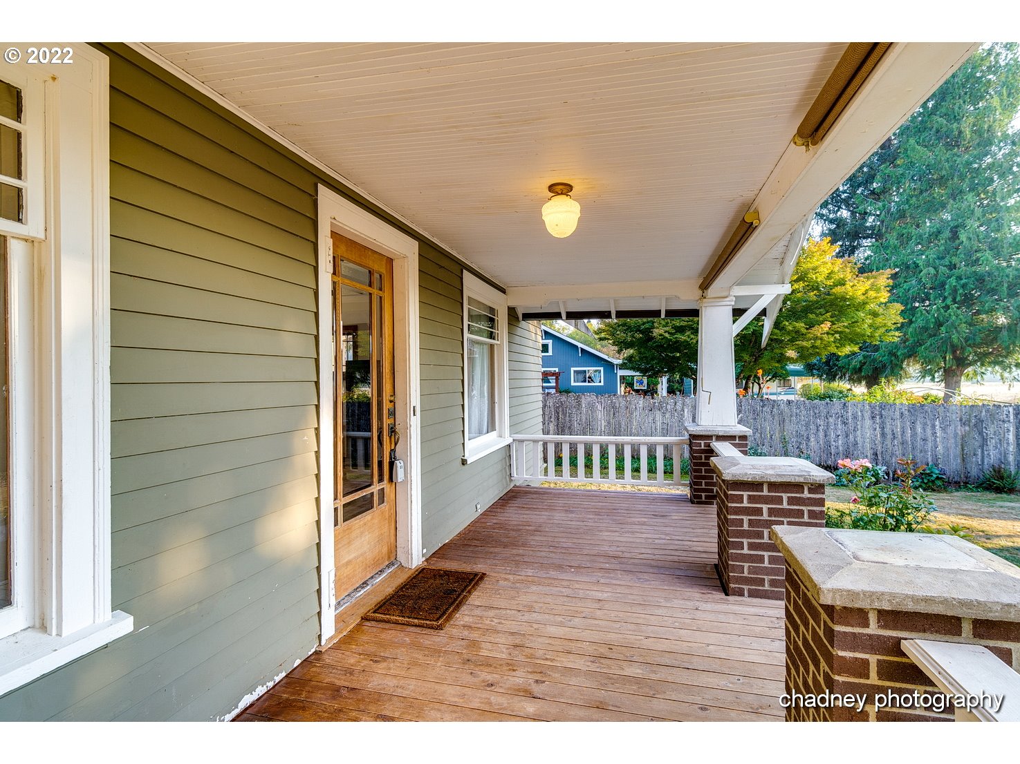 606 Southeast Northway Road Corbett, OR 97019 - Photo 6 of 32 a view of a patio with table and chairs with wooden floor and fence