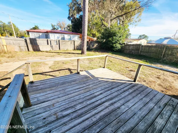 a view of a balcony with wooden floor