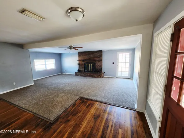 a view of livingroom with hardwood floor and a ceiling fan
