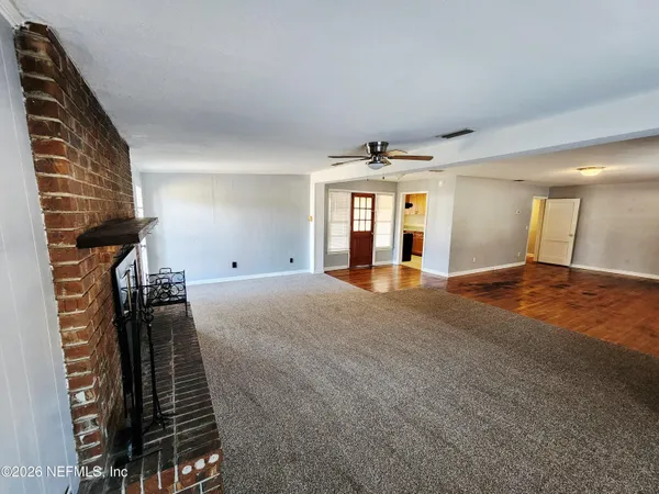 a view of a livingroom with a staircase