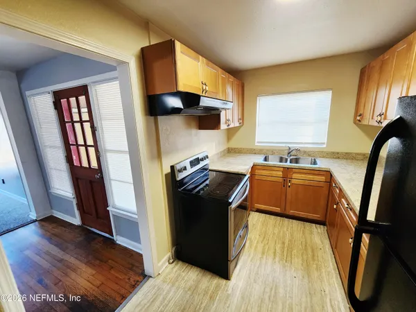 a view of a kitchen from a living room