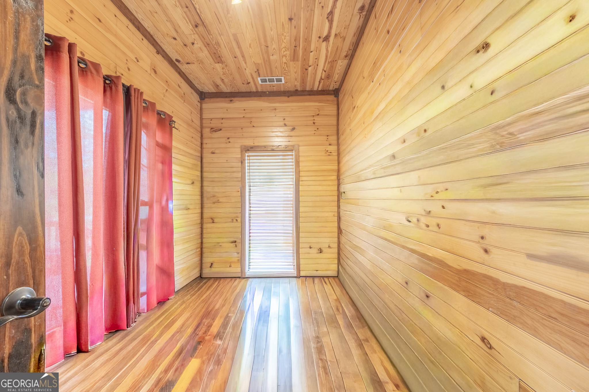 45 J J Davis Road Tallapoosa, GA 30176 - Photo 15 of 24 a view of a bathroom with wooden floor and a window