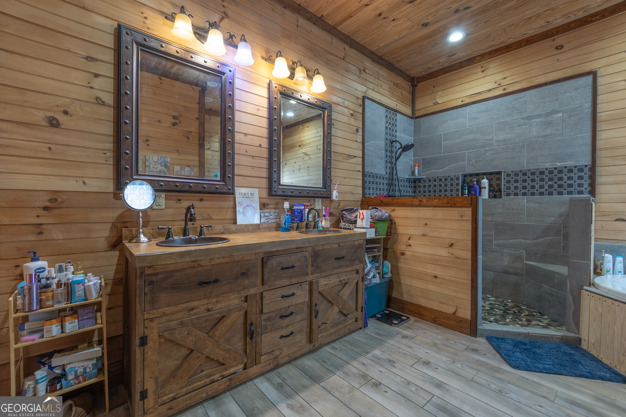 45 J J Davis Road Tallapoosa, GA 30176 - Photo 19 of 24 a bathroom with a sink and a mirror