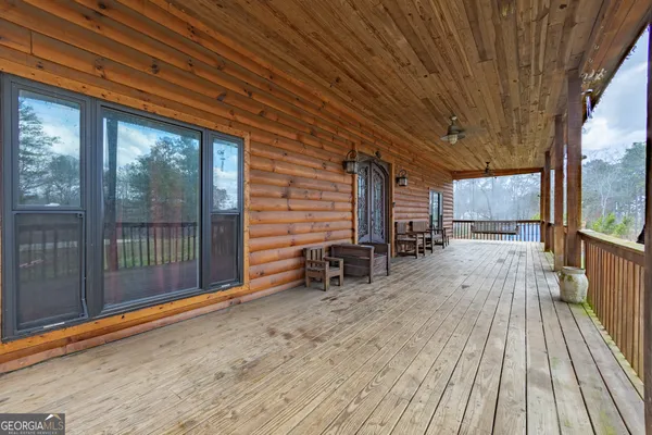 a view of outdoor space with wooden floor and iron stairs