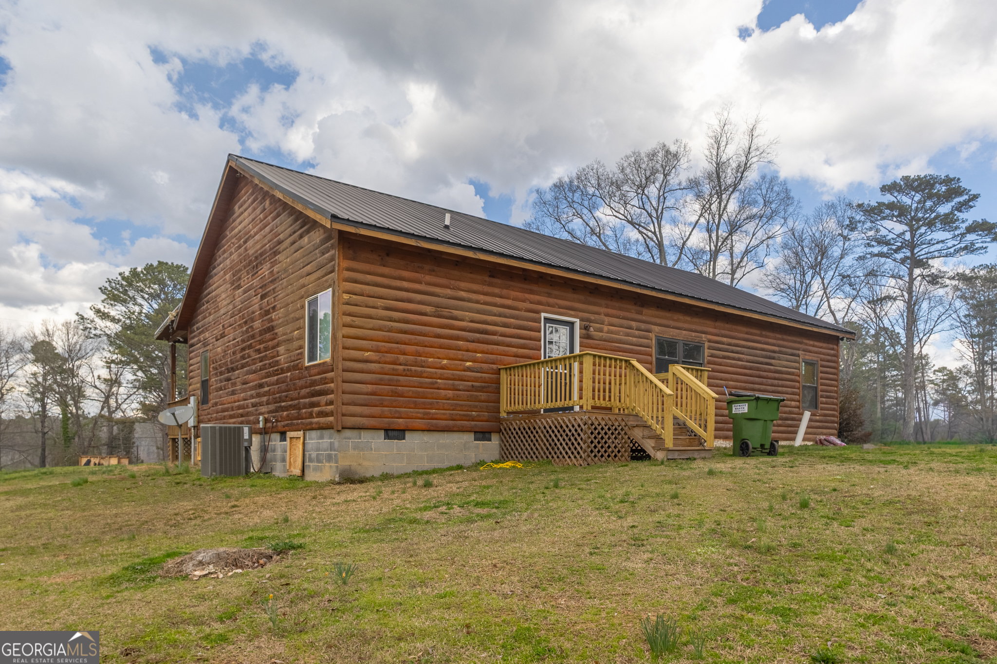 45 J J Davis Road Tallapoosa, GA 30176 - Photo 24 of 24 a view of a house with yard and a large tree