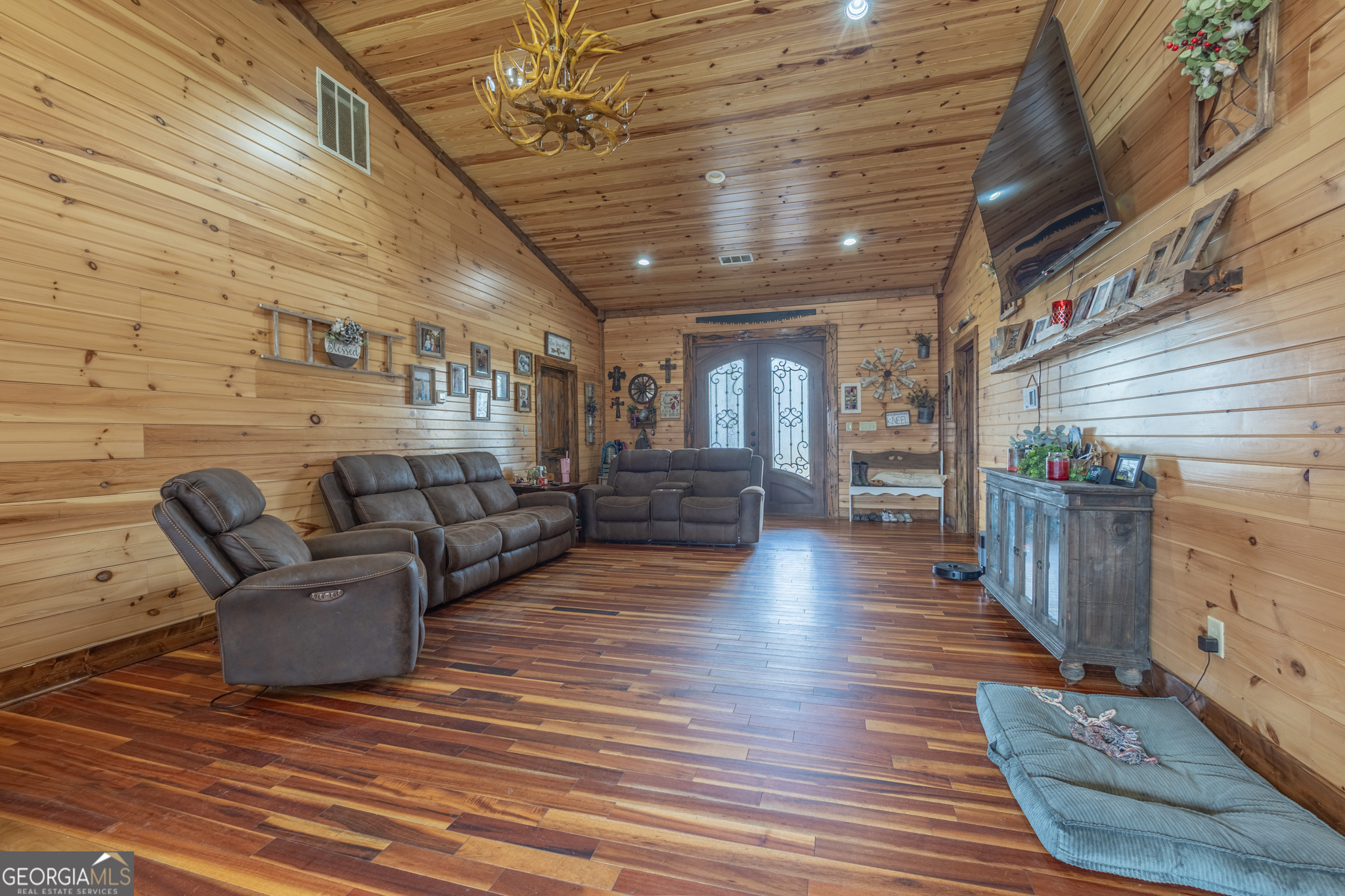 45 J J Davis Road Tallapoosa, GA 30176 - Photo 3 of 24 a living room with couches chairs and kitchen view with wooden floor