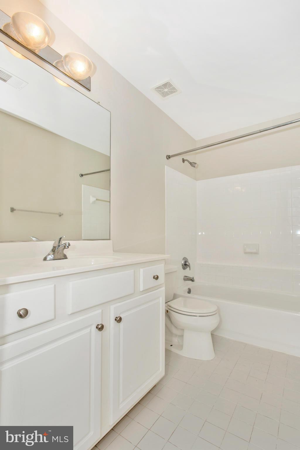 11006 Hemingway Court Silver Spring, MD 20902 - Photo 24 of 30 a bathroom with a sink a toilet and shower