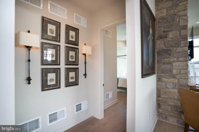 a hallway with windows and brick walls