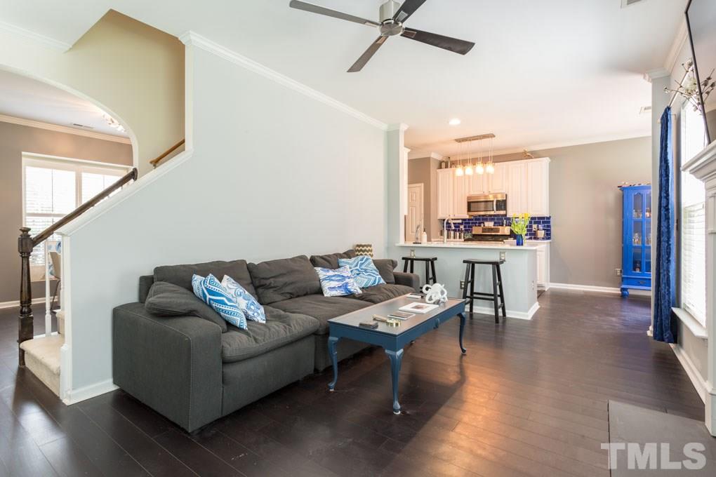 8419 Tie Stone Way Raleigh, NC 27613 - Photo 11 of 30 a living room with furniture and a wooden floor