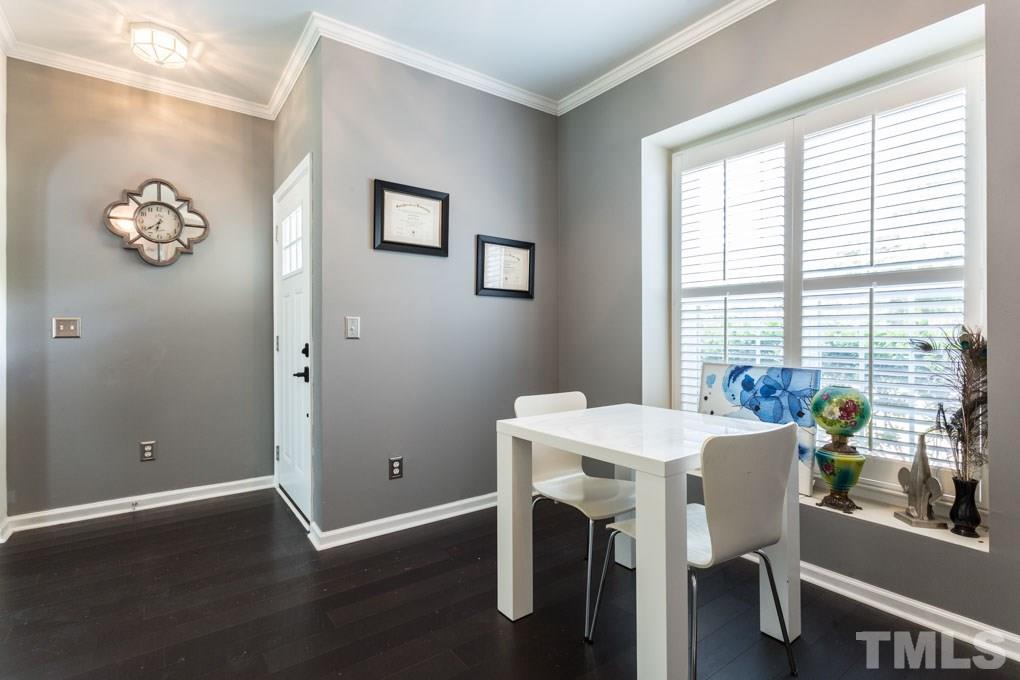 8419 Tie Stone Way Raleigh, NC 27613 - Photo 12 of 30 a view of a dining room with furniture and window