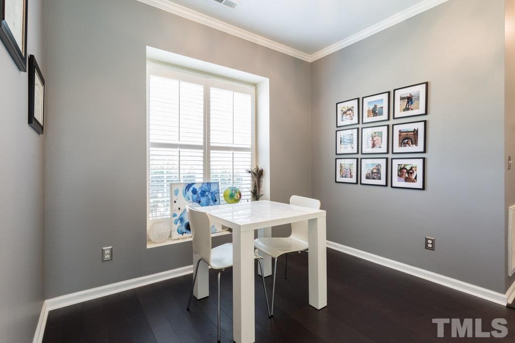 8419 Tie Stone Way Raleigh, NC 27613 - Photo 13 of 30 a view of a workspace with furniture and a window