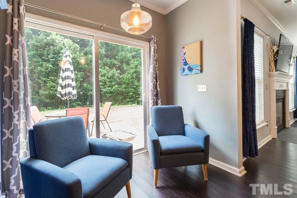 8419 Tie Stone Way Raleigh, NC 27613 - Photo 14 of 30 a living room with furniture and a window