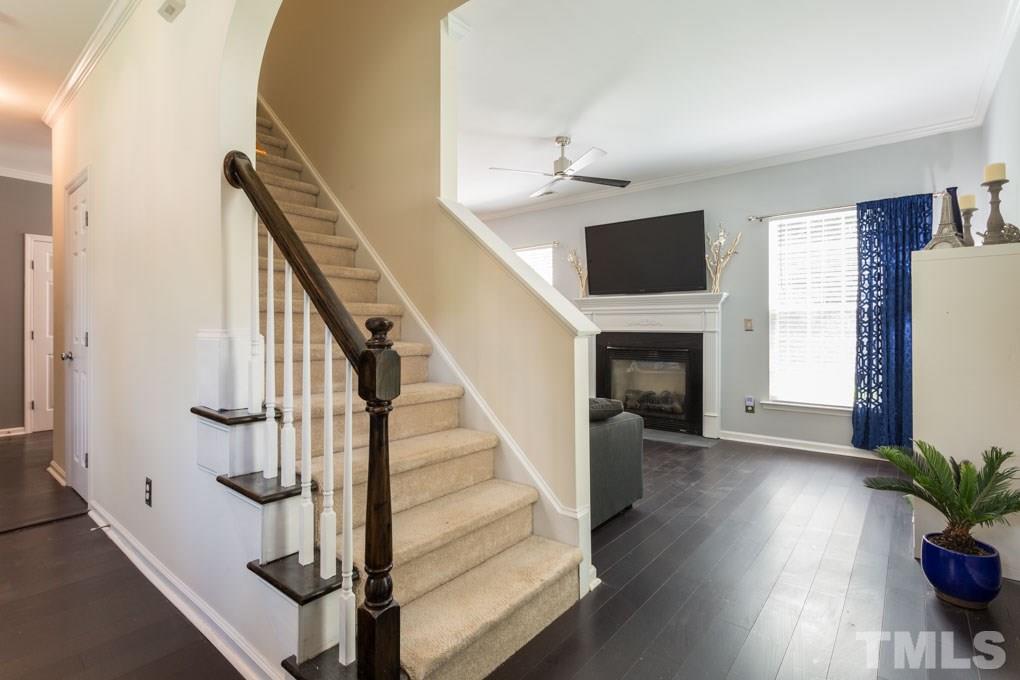 8419 Tie Stone Way Raleigh, NC 27613 - Photo 16 of 30 a view of entryway and hall with wooden floor