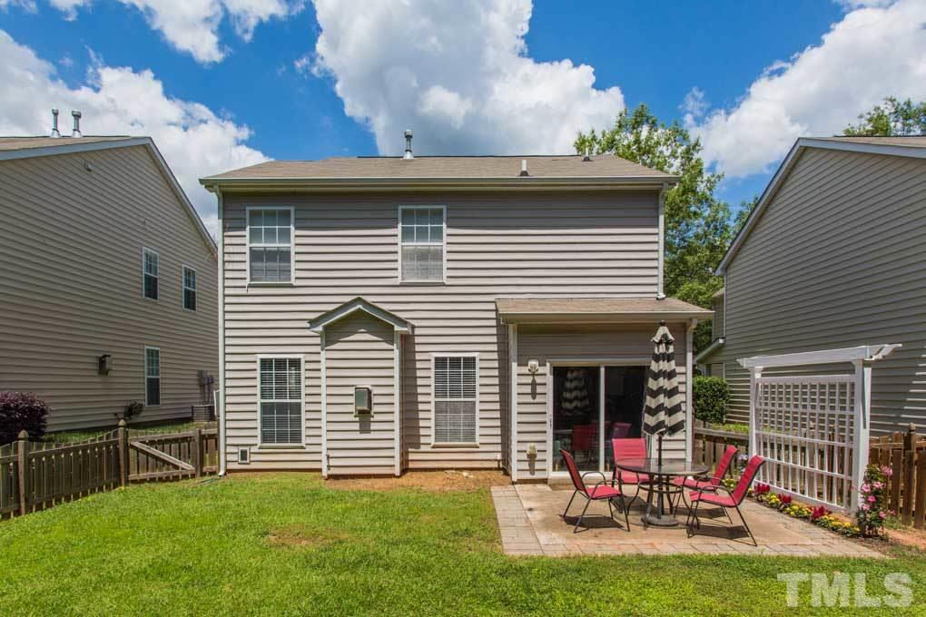 8419 Tie Stone Way Raleigh, NC 27613 - Photo 29 of 30 a view of a house with a yard and sitting area