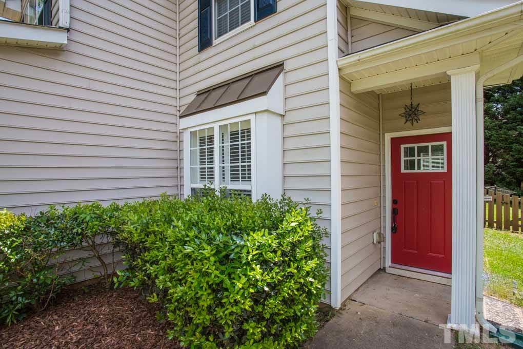 8419 Tie Stone Way Raleigh, NC 27613 - Photo 30 of 30 front view of a house with a yard
