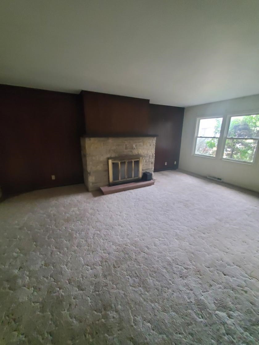 1486 Winter Drive Freeport, IL 61032 - Photo 13 of 20 an empty room with a fireplace and window