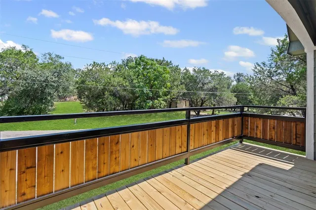 a view of wooden deck with a yard