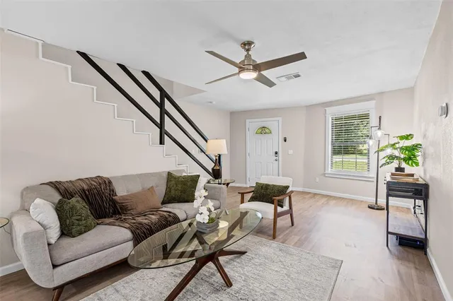 a living room with furniture and a window