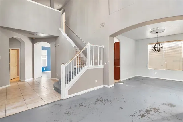 en view interior of a house with wooden floor and windows